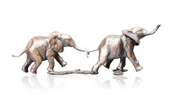 Bronze sculpture of two elephants following each other