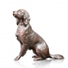 bronze sculpture of a springer spaniel sitting and looking up