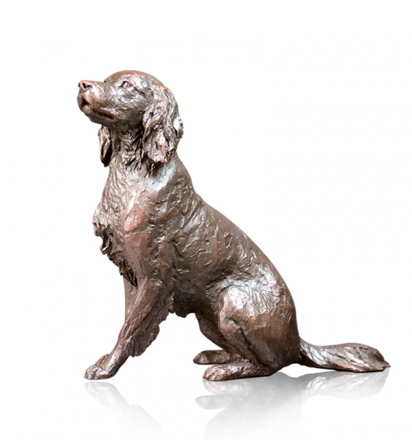 bronze sculpture of a springer spaniel sitting and looking up