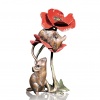 Bronze mice playing on a red poppy