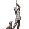 Bronze sculpture of a man shooting with his dog