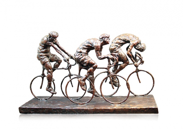 bronze sculpture of three cyclists racing