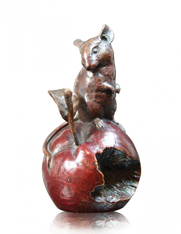 bronze sculpture of a small mouse on an apple