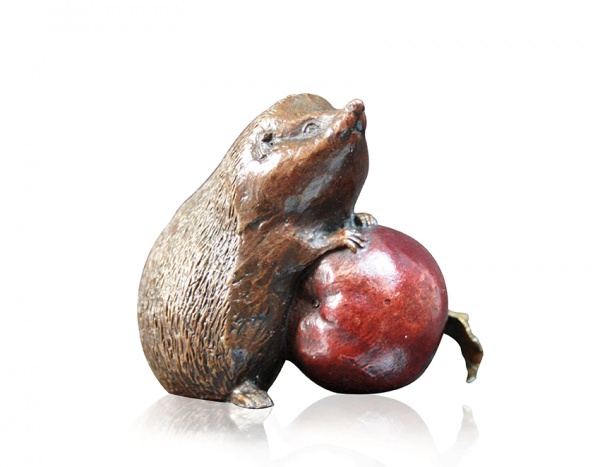 cute hedgehog bronze sculpture with an apple