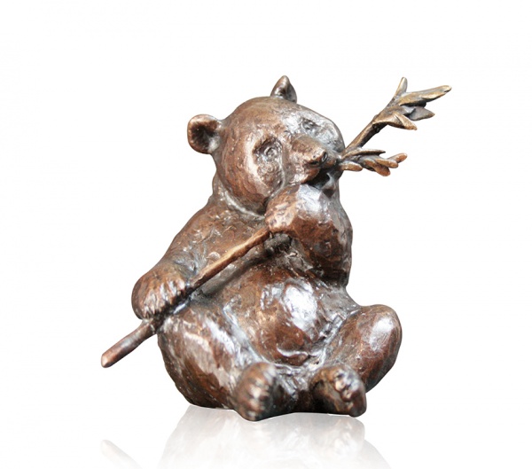 Bronze sculpture of a panda eating bamboo