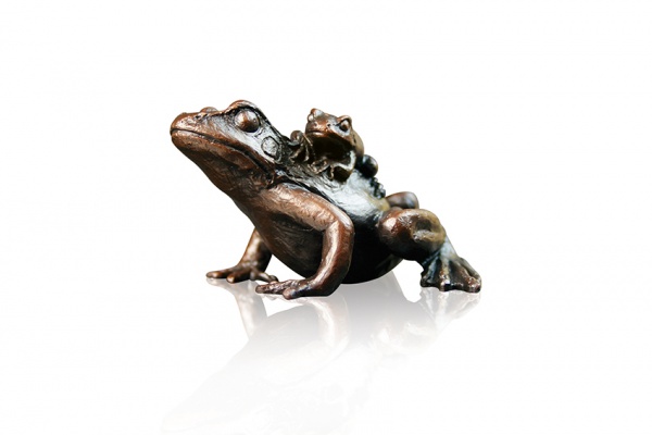 small bronze frog with baby on its back