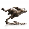 medium sized bronze sculpture of a hare running
