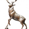 small bronze sculpture of a stag in the highlands