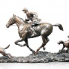 bronze sculpture showing a hunting scene with hounds and horse
