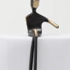 bronze sculpture of a man in a black patina with polished features by artist yenny cocq