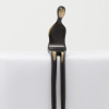 bronze sculpture of a girl in a black patina with polished features by artist yenny cocq