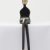 bronze sculpture of a woman in a black patina with polished features by artist yenny cocq