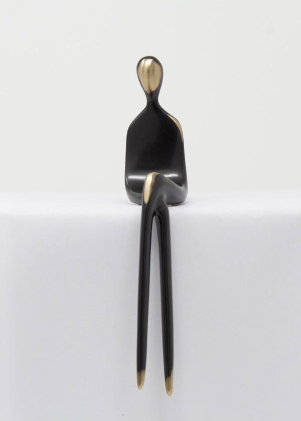 bronze sculpture of a woman in a black patina with polished features by artist yenny cocq