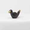 bronze sculpture of a bird in a black patina with polished features by artist yenny cocq