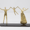 signed limited edition bronze sculpture by artist Anna Andreadi of a child holding hands with parents
