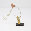 Limited Edition Bronze Sculpture featuring a couple in a romantic setting with a heart shaped kite by Anna Andreadi