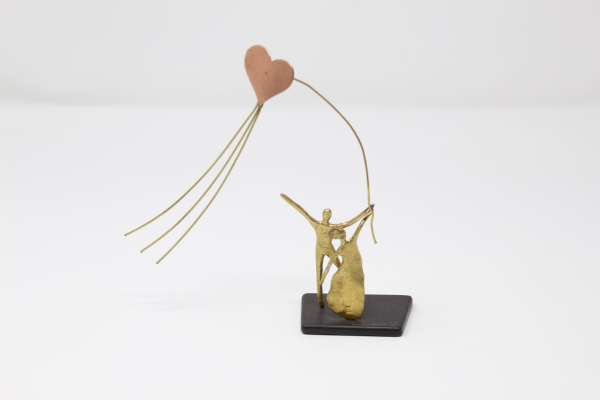 Limited Edition Bronze Sculpture featuring a couple in a romantic setting with a heart shaped kite by Anna Andreadi