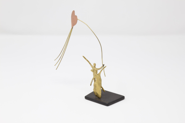 Limited Edition Bronze Sculpture featuring a couple in a romantic setting with a heart shaped kite by Anna Andreadi