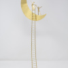 Limited Edition hand made bronze sculpture featuring a couple celebrating over the moon which they just climbed together by Anna Andreadi