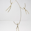 signed limited edition bronze sculpture by artist Anna Andreadi of three figures balancing around a curving pole
