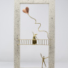 Limited Edition hand made bronze sculpture featuring a couple setting where she is above him on a balcony while he is serenading her and sending her heart shaped balloons her way in a lovely contrasty white frame by Anna Andreadi
