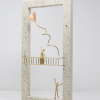 Limited Edition hand made bronze sculpture featuring a couple setting where she is above him on a balcony while he is serenading her and sending her heart shaped balloons her way in a lovely contrasty white frame by Anna Andreadi