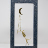Limited Edition hand made bronze sculpture featuring a couple setting where she is above him floating trying to climb a ladder that would help her reach the moon in a lovely contrasty blue frame by Anna Andreadi
