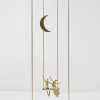 Limited Edition hand made bronze sculpture featuring a couple sitting on a swing under the moon by Anna Andreadi