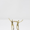 Limited Edition hand made bronze sculpture featuring a gay men couple embracing each other at the same time as celebrating their union by Anna Andreadi