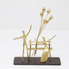 Limited Edition bronze sculpture featuring a couple sitting on a bench and celebrating a special occasion with floating balloons by Anna Andreadi