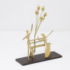 Limited Edition bronze sculpture featuring a couple sitting on a bench and celebrating a special occasion with floating balloons by Anna Andreadi