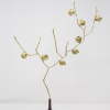 Limited Edition hand made bronze sculpture featuring a expressive branch with leaves coming out of an elegant dark vase by Anna Andreadi