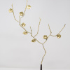 Limited Edition hand made bronze sculpture featuring a expressive branch with leaves coming out of an elegant dark vase by Anna Andreadi