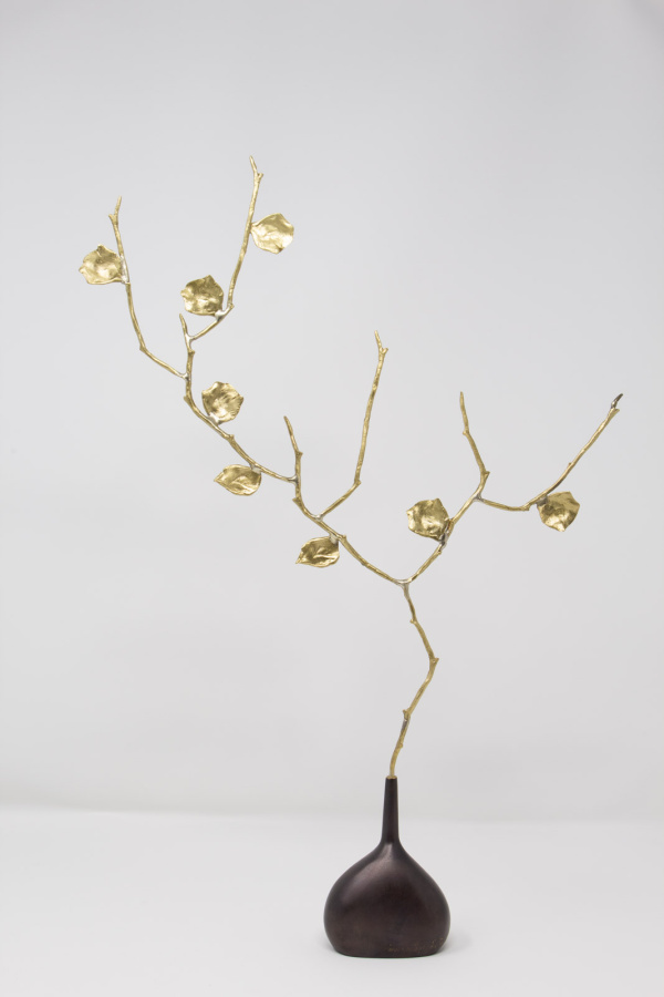 Limited Edition hand made bronze sculpture featuring a expressive branch with leaves coming out of an elegant dark vase by Anna Andreadi