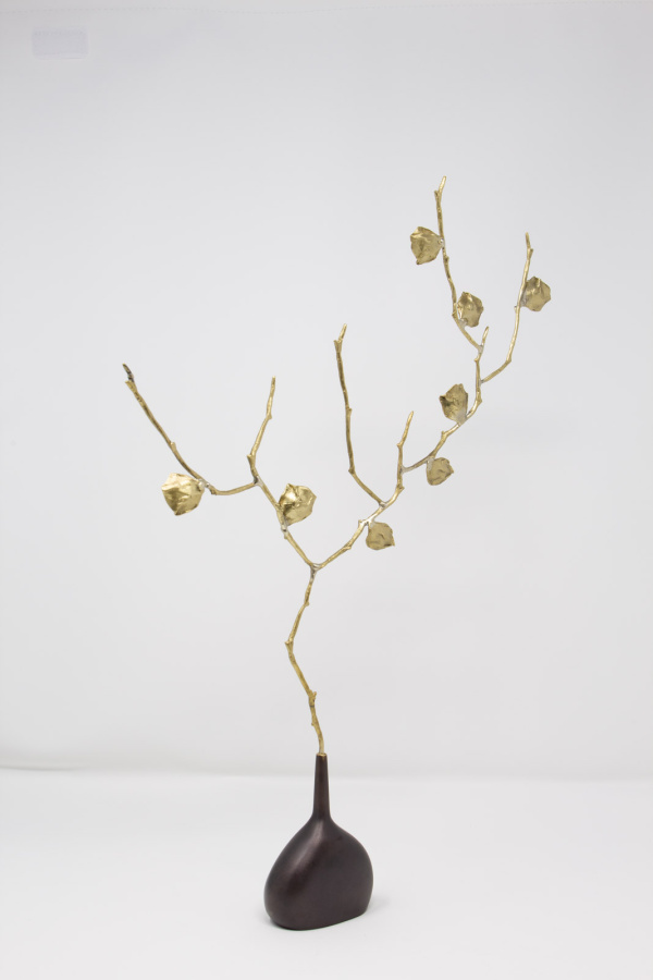 Limited Edition hand made bronze sculpture featuring a expressive branch with leaves coming out of an elegant dark vase by Anna Andreadi