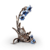 bronze sculpture of a mouse with bluebell flowers
