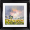 striking landscape painting with meadow in the foreground full of wild flowers and a burst of orange light through the clouds by artist allan morgan