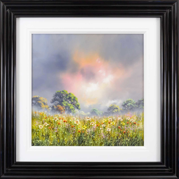 striking landscape painting with meadow in the foreground full of wild flowers and a burst of orange light through the clouds by artist allan morgan