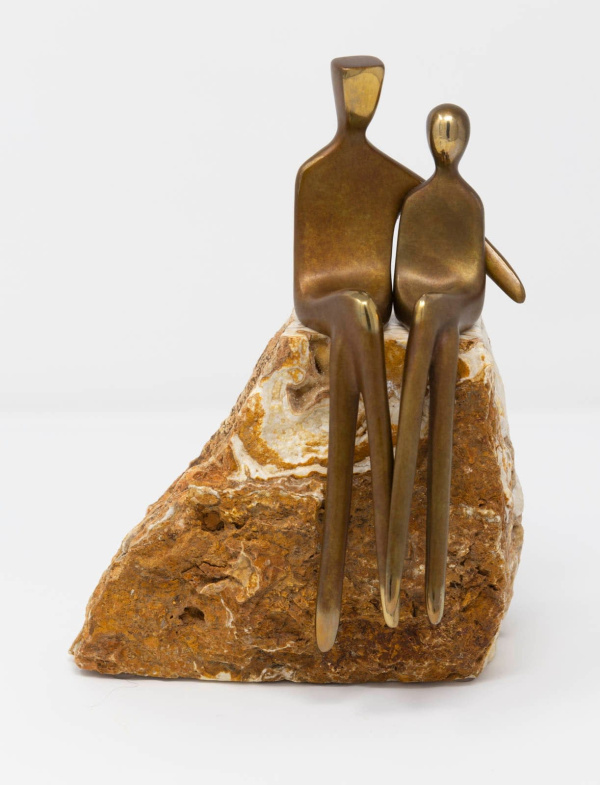 limited edition bronze sculpture of two statuettes in a minimalist style embracing one another in a romantic pose sat atop a solid stone base