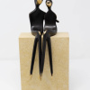 large limited edition bronze sculpture of two statuettes in a minimalist style embracing one another in a romantic pose sat atop a solid stone base finished in a dark black patina with golden polished elements
