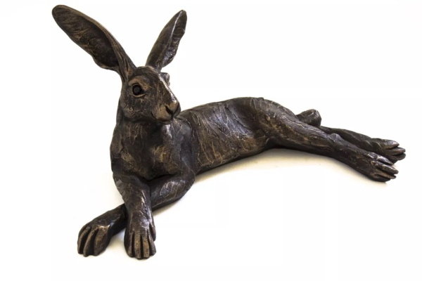 Limited edition resin and bronze finished hand sculpture featuring a hare reclining by talented UK female artist Suzie Marsh